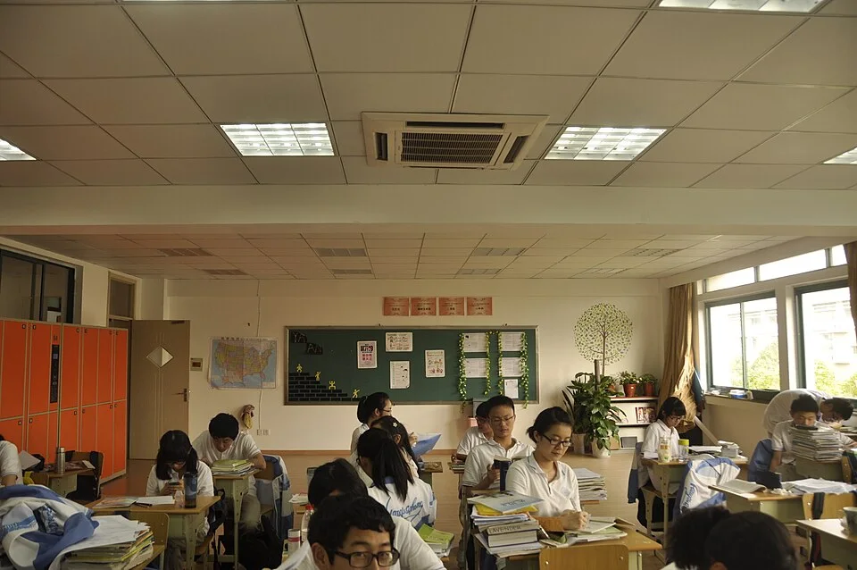Students learning in a classroom — real photograph